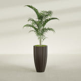 San Jose Tall Fluted fiberglass planter in Matte Dark Brown, shown planted, in a sunlit interior