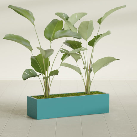 Cuba Corner fiberglass planter in Satin Seafoam Green, shown planted, in a sunlit interior