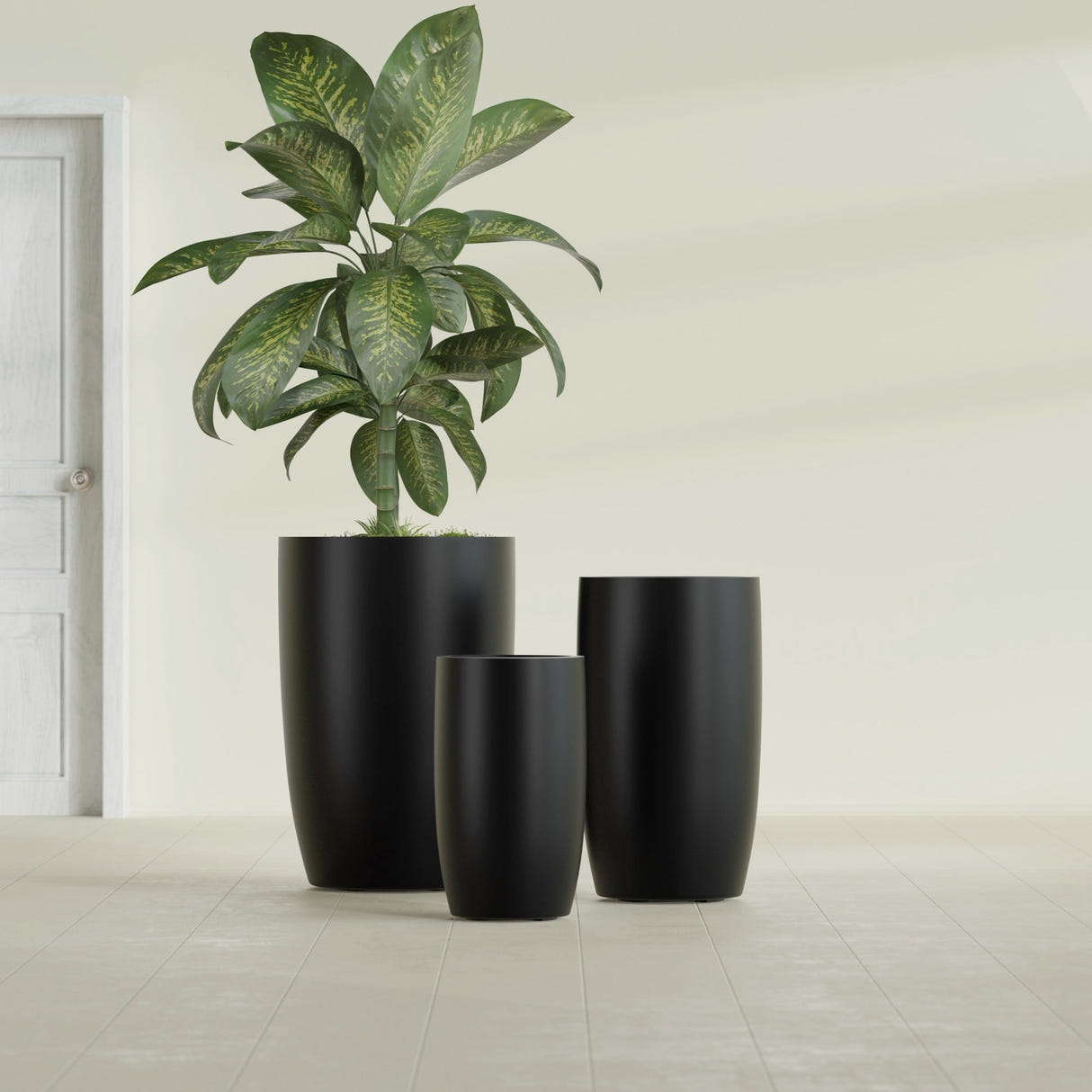 Lisbon Tall Round fiberglass planter in Matte Black, size range, in a sunlit interior