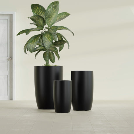 Lisbon Tall Round fiberglass planter in Matte Black, size range, in a sunlit interior