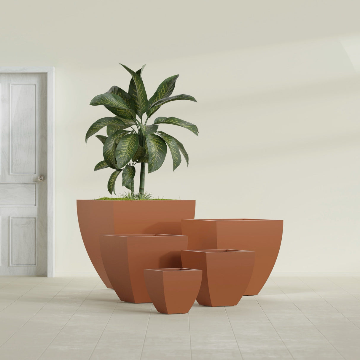 Lima Tapered Square fiberglass planter in Matte Terra Cotta, size range, in a sunlit interior