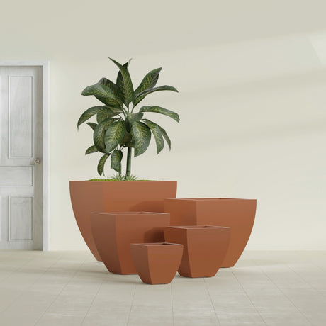 Lima Tapered Square fiberglass planter in Matte Terra Cotta, size range, in a sunlit interior