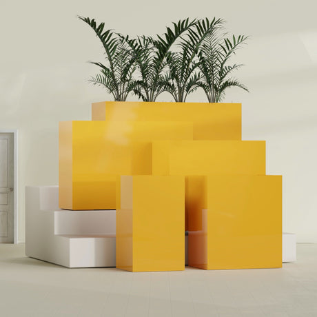Darwin Corner fiberglass planter in Gloss Saffron, size range, in a sunlit interior