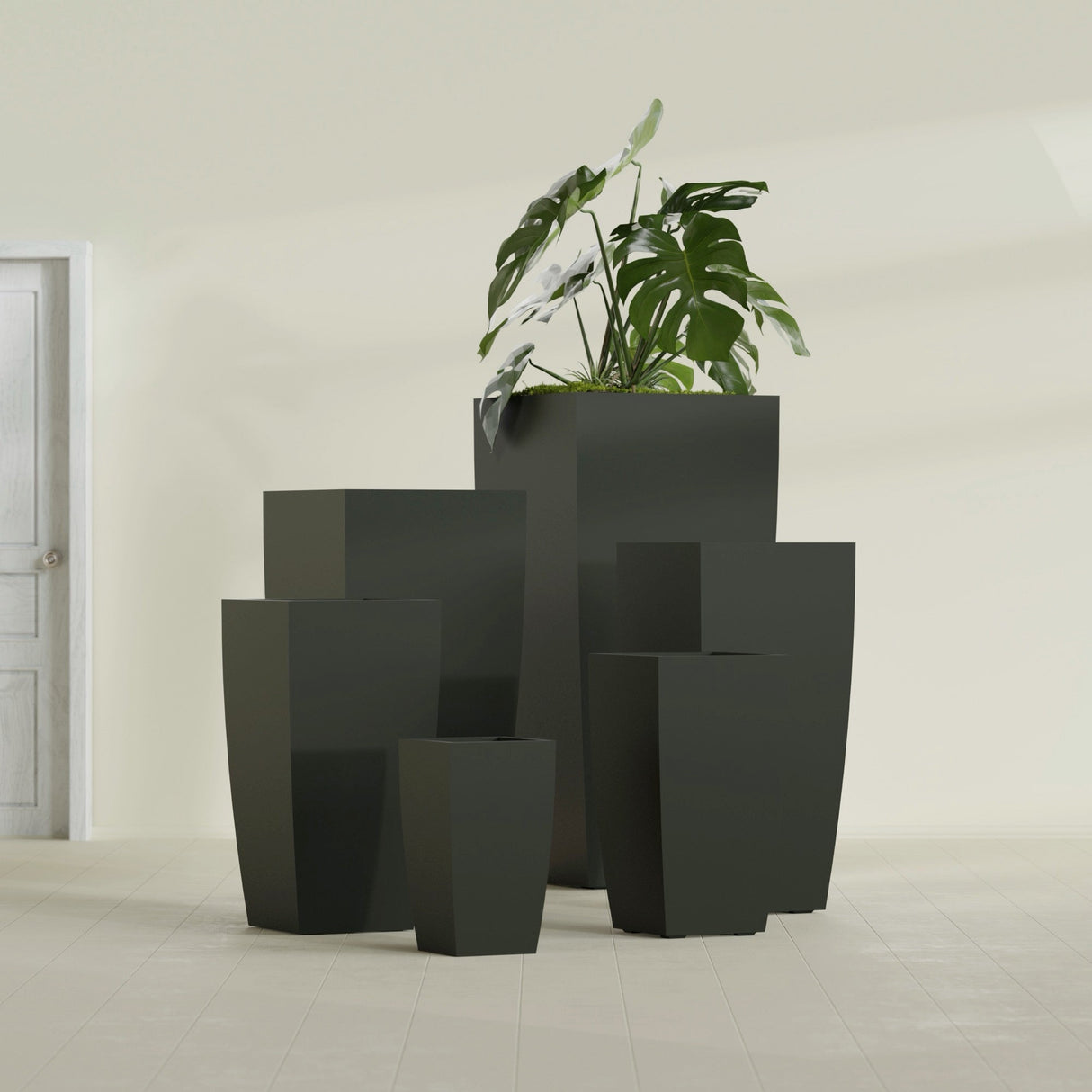 Toulan Tapered Square fiberglass planter in Matte Charcoal, size range, in a sunlit interior