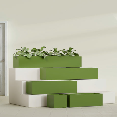 Cuba Corner fiberglass planter in Satin Green, size range, in a sunlit interior