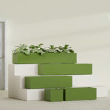 Cuba Low Rectangular fiberglass planter in Satin Green, size range, in a sunlit interior