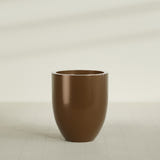 Valencia Tapered Round Planter in Metallic Bronze, 27"D × 31"H, shown empty