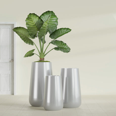 Saigon Tapered Round fiberglass planter in Metallic Silver, size range, in a sunlit interior