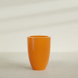 Brannan Tapered Round Planter in Gloss Tangerine, 30"D × 41"H, shown empty