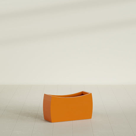 Seoul Curved Planter in Gloss Tangerine, 32"L × 12"D × 18"H, shown empty