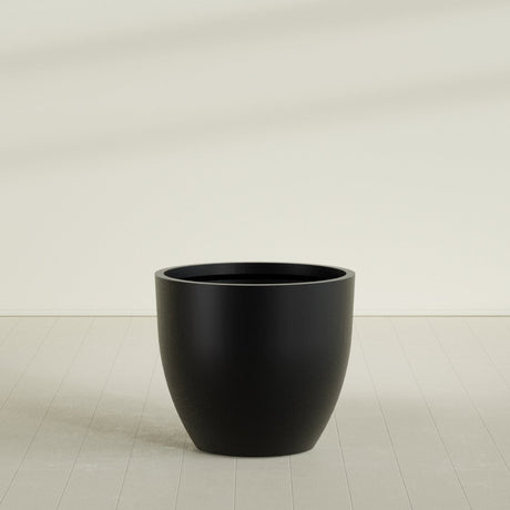 Wannsee Round Planter in Matte Black, 44"D × 39"H, shown empty