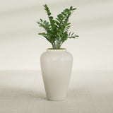 Barà Jar fiberglass planter in Satin Beige, shown planted, in a sunlit interior