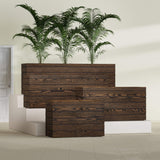 Siena planter in textured walnut, size range, in a sunlit interior