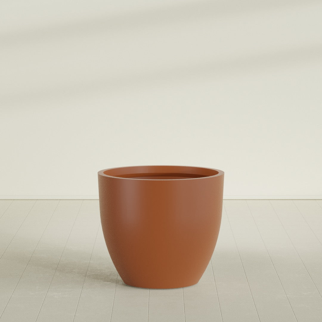 Wannsee Round Planter in Matte Terra Cotta, 44"D × 39"H, shown empty