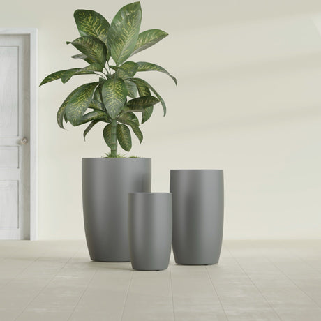 Lisbon Tall Round fiberglass planter in Matte Gunmetal, size range, in a sunlit interior