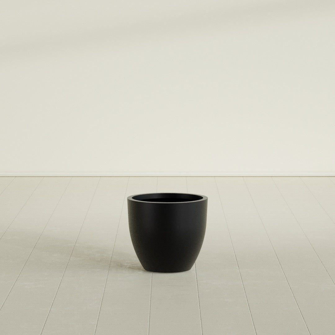 Wannsee Round Planter in Matte Black, 22"D × 19"H, shown empty