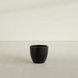 Wannsee Round Planter in Matte Black, 22"D × 19"H, shown empty