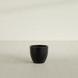 Wannsee Round Planter in Matte Black, 22"D × 19"H, shown empty