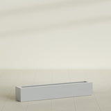 Salon Box Planter in Metallic Silver, 48" Long, shown empty