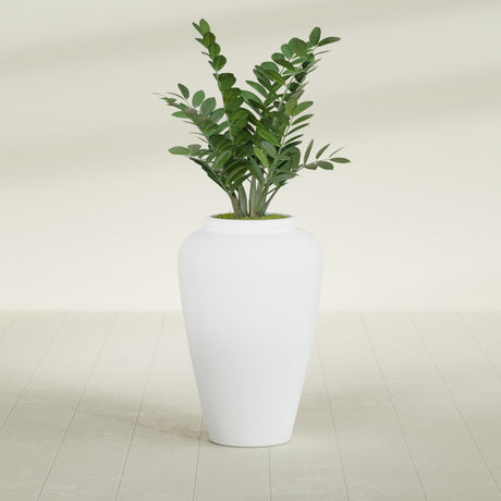 Barà Jar fiberglass planter in Gloss Bright White, shown planted, in a sunlit interior