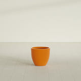 Wannsee Round Planter in Gloss Tangerine, 22"D × 19"H, shown empty