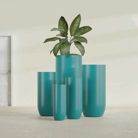 Saint Tropez Bullet Round fiberglass planter in Satin Seafoam Green, size range, in a sunlit interior