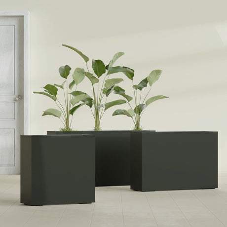 Milano Narrow Rectangular fiberglass planter in Matte Charcoal, shown planted, in a sunlit interior