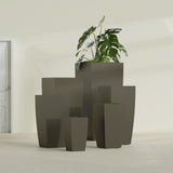 Toulan Tapered Square fiberglass planter in Matte Bronze, size range, in a sunlit interior