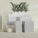 Darwin Rectangular fiberglass planter in Metallic Silver, size range, in a sunlit interior