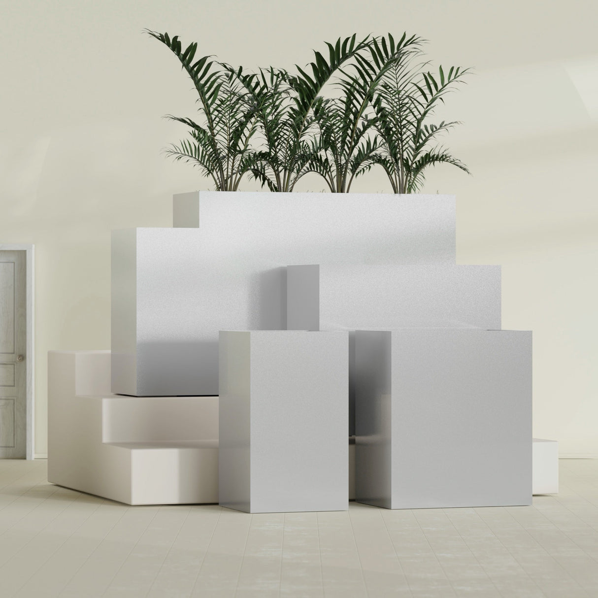 Darwin Corner fiberglass planter in Metallic Silver, size range, in a sunlit interior