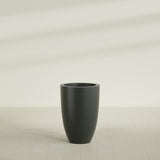 Brannan Tapered Round Planter in Matte Charcoal, 24"D × 35"H, shown empty