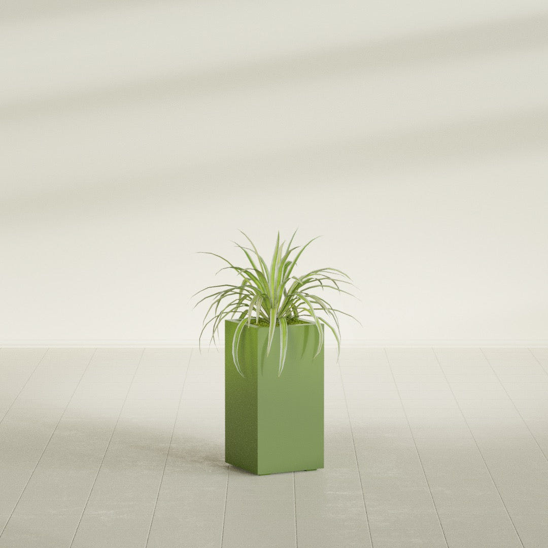 Hollywood Narrow Rectangular fiberglass planter in Satin Green, shown planted, in a sunlit interior