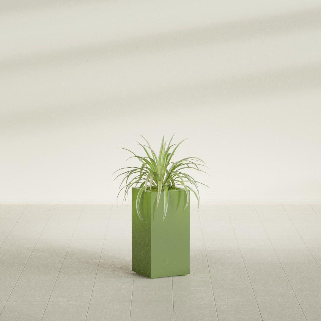 Hollywood Narrow Rectangular fiberglass planter in Satin Green, shown planted, in a sunlit interior