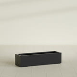 Cuba Low Rectangular Planter in Matte Black, 48"L × 14"D × 12"H, shown empty