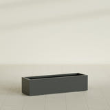 Cuba Low Rectangular Planter in Matte Charcoal, 48"L × 14"D × 12"H, shown empty