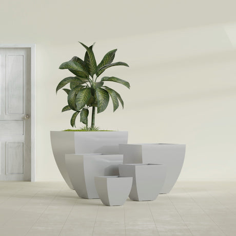 Lima Tapered Square fiberglass planter in Metallic Silver, size range, in a sunlit interior