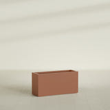 Hollywood Narrow Rectangular Planter in Matte Terra Cotta, 36"L × 12"D × 24"H, shown empty
