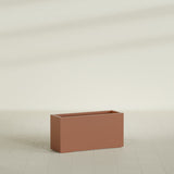 Hollywood Narrow Rectangular Planter in Matte Terra Cotta, 36"L × 12"D × 24"H, shown empty