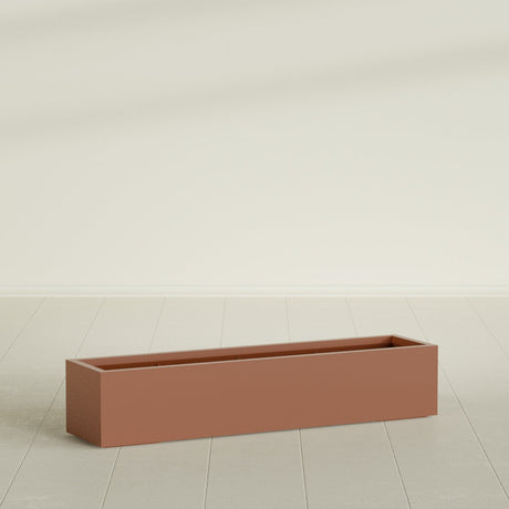 Cuba Low Rectangular Planter in Matte Terra Cotta, 60"L × 14"D × 12"H, shown empty