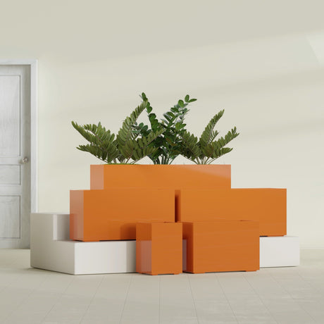 Tolga Corner fiberglass planter in Gloss Tangerine, size range, in a sunlit interior