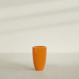 Brannan Tapered Round Planter in Gloss Tangerine, 18"D × 29"H, shown empty