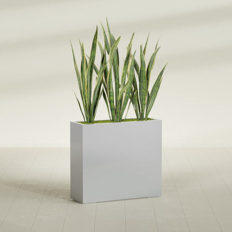 Delray Corner fiberglass planter in Metallic Silver, shown planted, in a sunlit interior