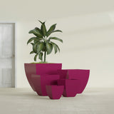 Lima Tapered Square fiberglass planter in Gloss Eggplant, size range, in a sunlit interior