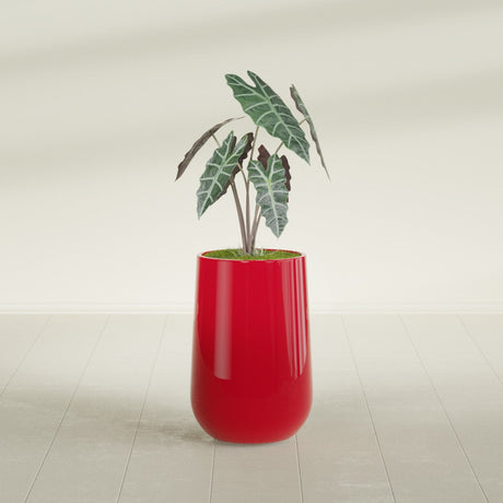Hayden Urn fiberglass planter in Gloss Red, shown planted, in a sunlit interior