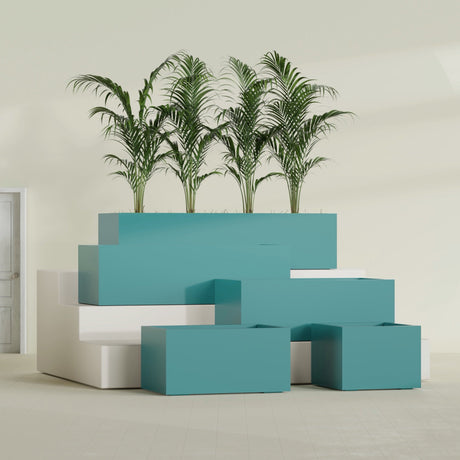 Torino Corner fiberglass planter in Satin Seafoam Green, size range, in a sunlit interior