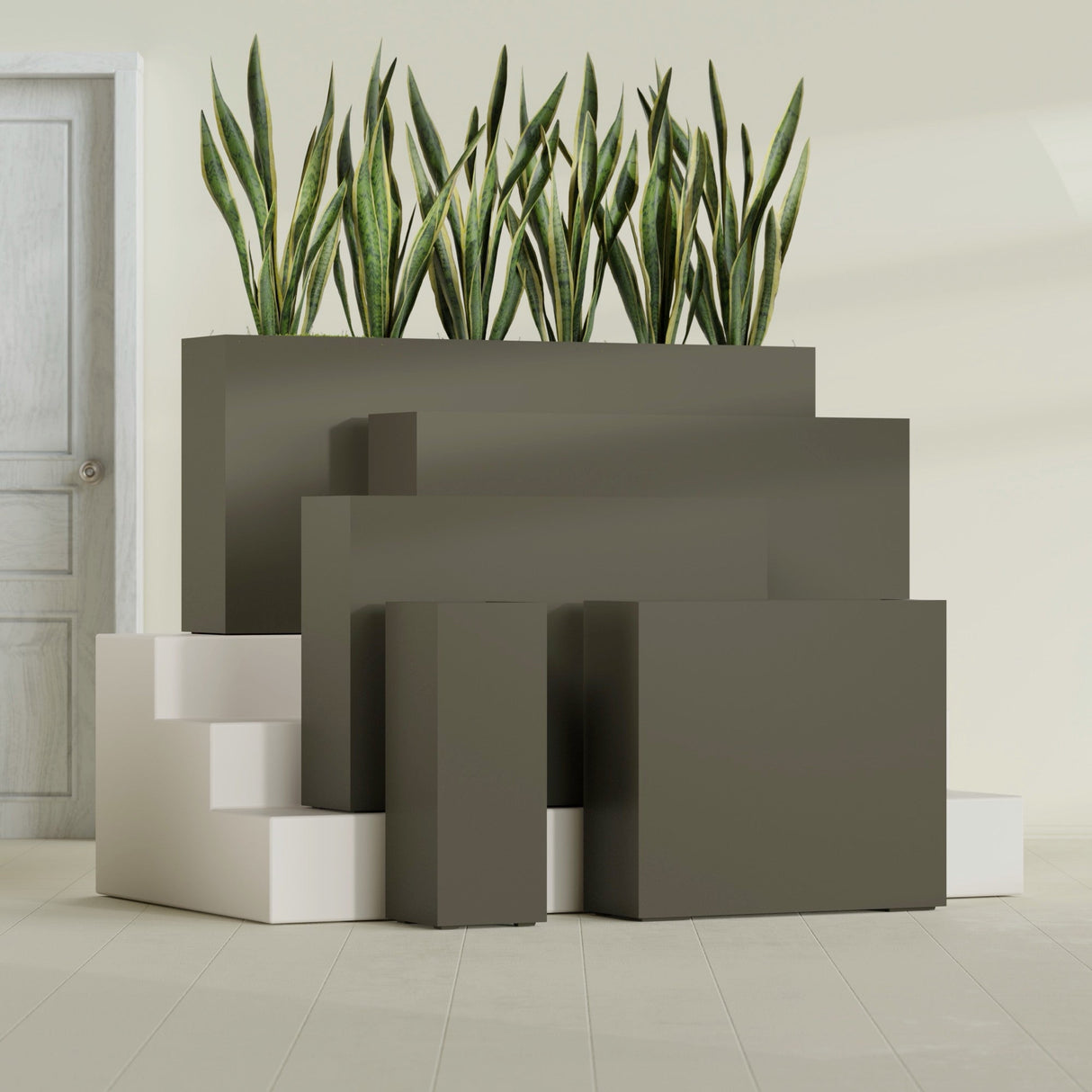 Delray Corner fiberglass planter in Matte Bronze, size range, in a sunlit interior