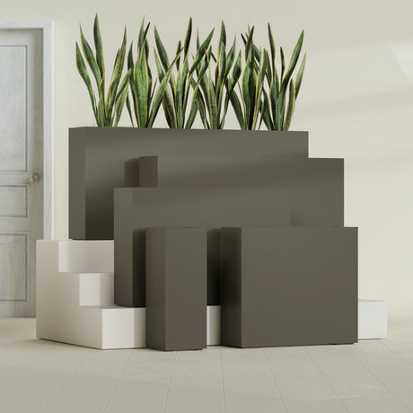 Delray Corner fiberglass planter in Matte Bronze, size range, in a sunlit interior