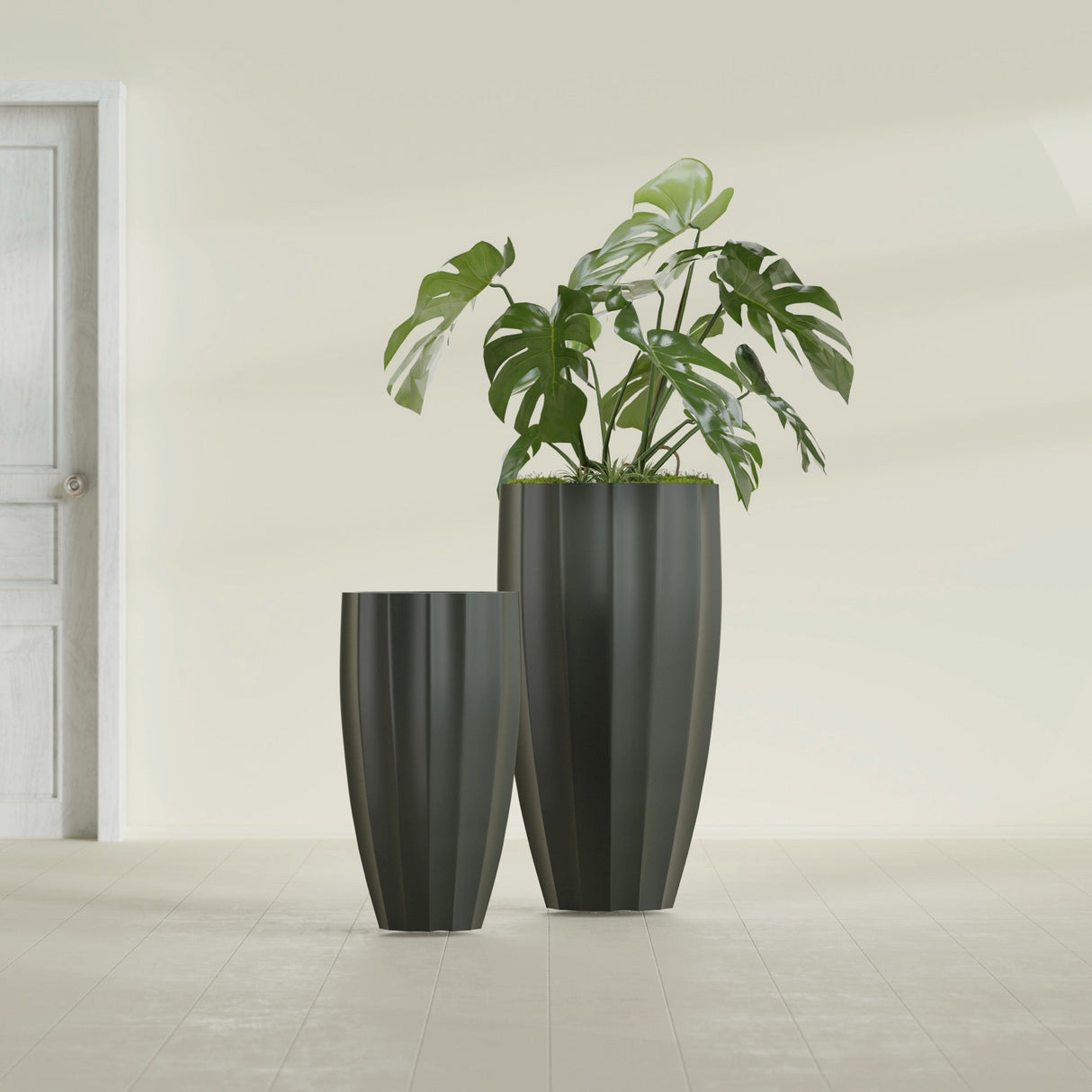 San Jose Tall Fluted fiberglass planter in Matte Charcoal, size range, in a sunlit interior