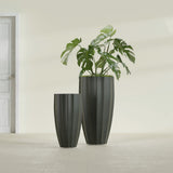 San Jose Tall Fluted fiberglass planter in Matte Charcoal, size range, in a sunlit interior