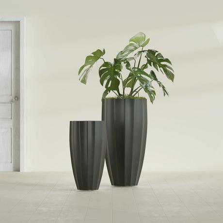 San Jose Tall Fluted fiberglass planter in Matte Charcoal, size range, in a sunlit interior